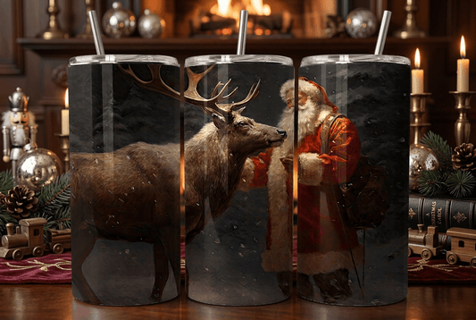 Three tall insulated tumblers with metal straws, each printed with a festive holiday scene featuring a deer, snow, and Santa Claus, displayed on a decorated Christmas table.